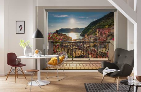Оформление стены на кухне фотообоями с изображением открытого балкона и пейзажа